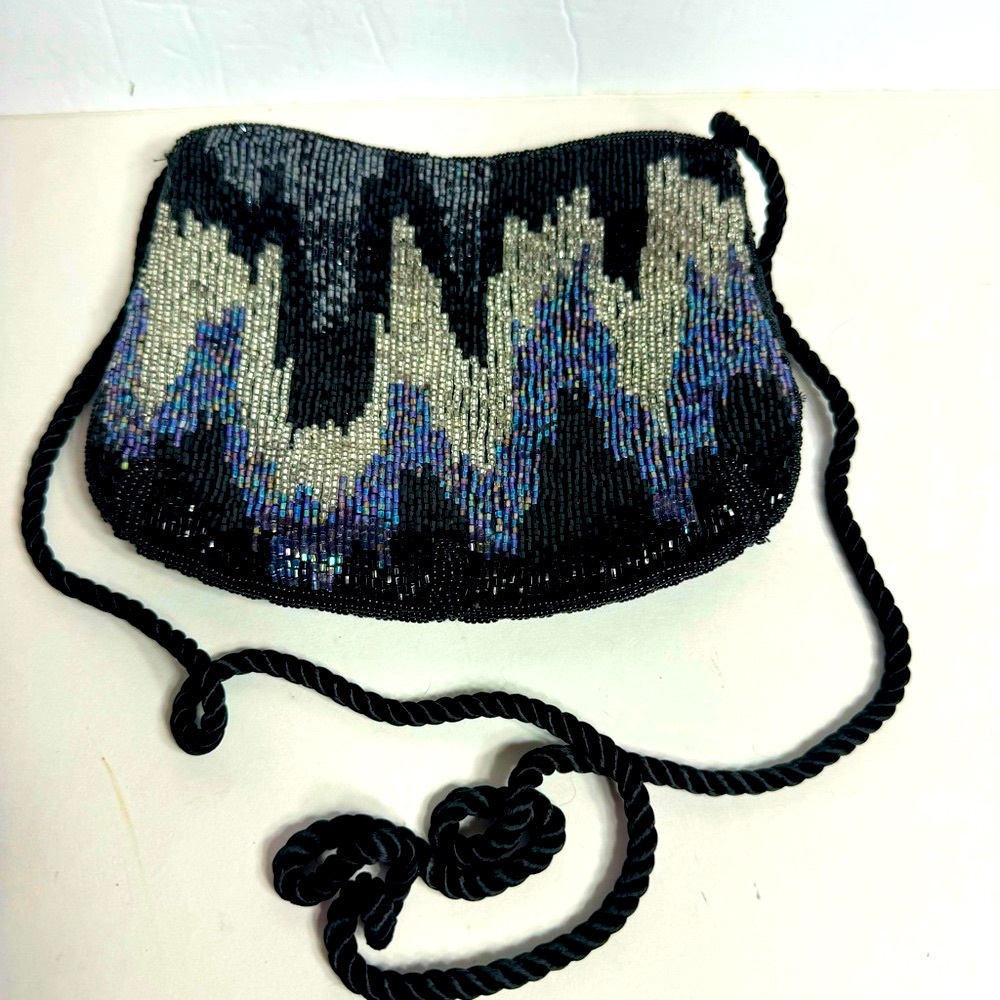 EUC. Beaded crossbody evening bag. Blue, black
And silver beading. Zipper top.
